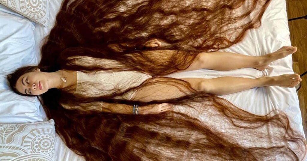 With 90-inches of flowing brown locks, this real life Rapunzel has hair brushing the ground behind her